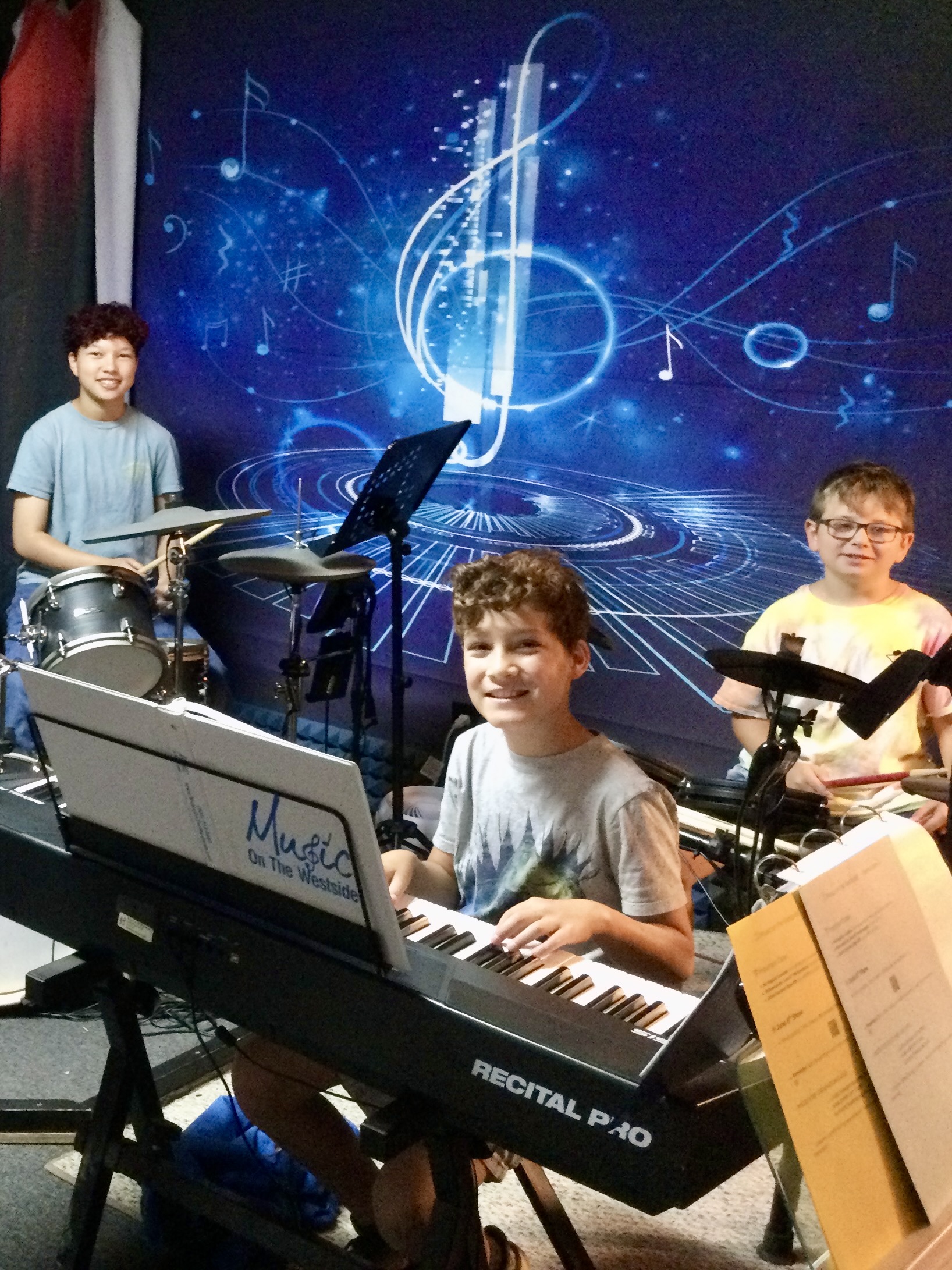 Piano students rehearsing at Music on the Westside
